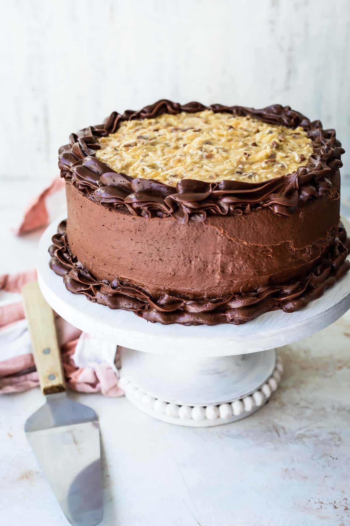 Frosting a German Chocolate Cake.