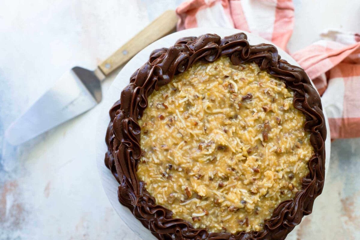 Frosting a German Chocolate Cake.