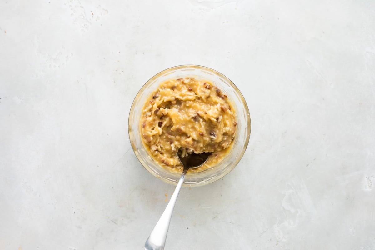 A bowl of caramel frosting.