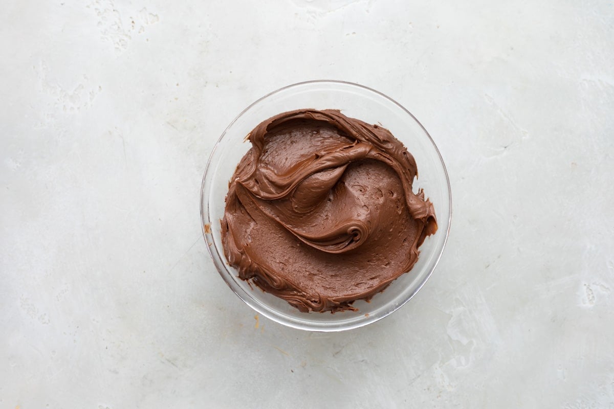 A bowl of chocolate frosting.