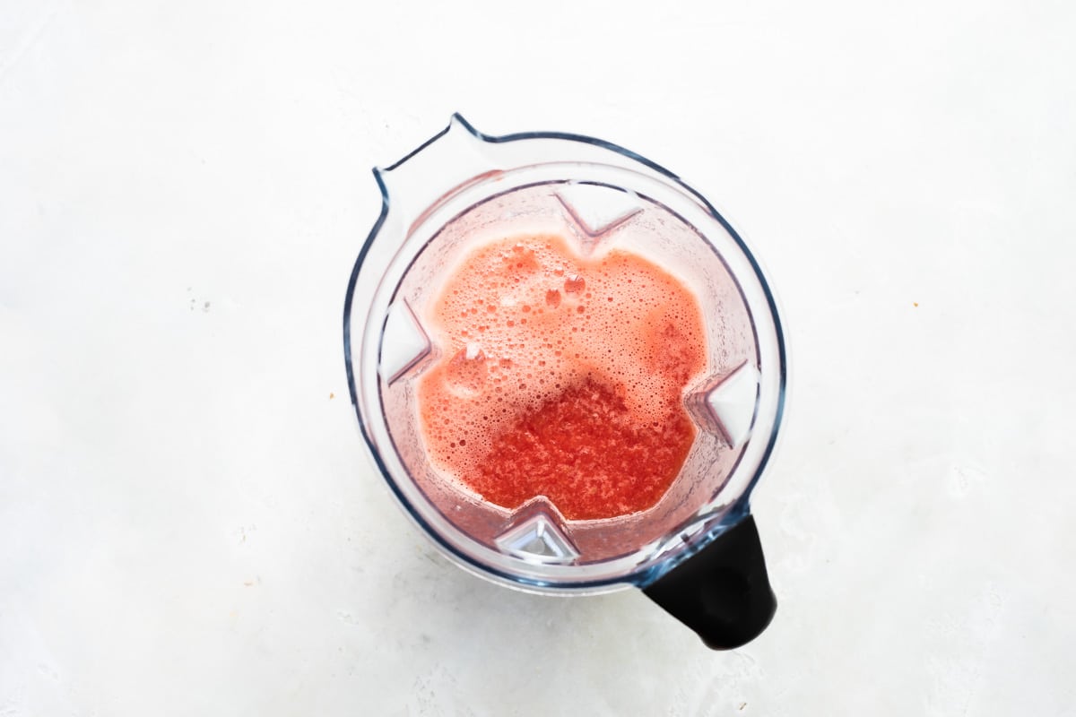 Blending watermelon with water and sugar ot make granita.
