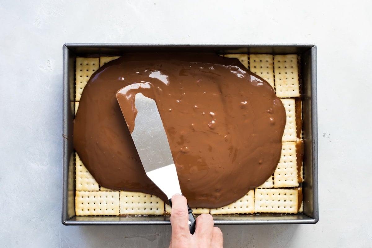 Melted chocolate, buttescotch, and peanut butter to go on top of Twix bars.