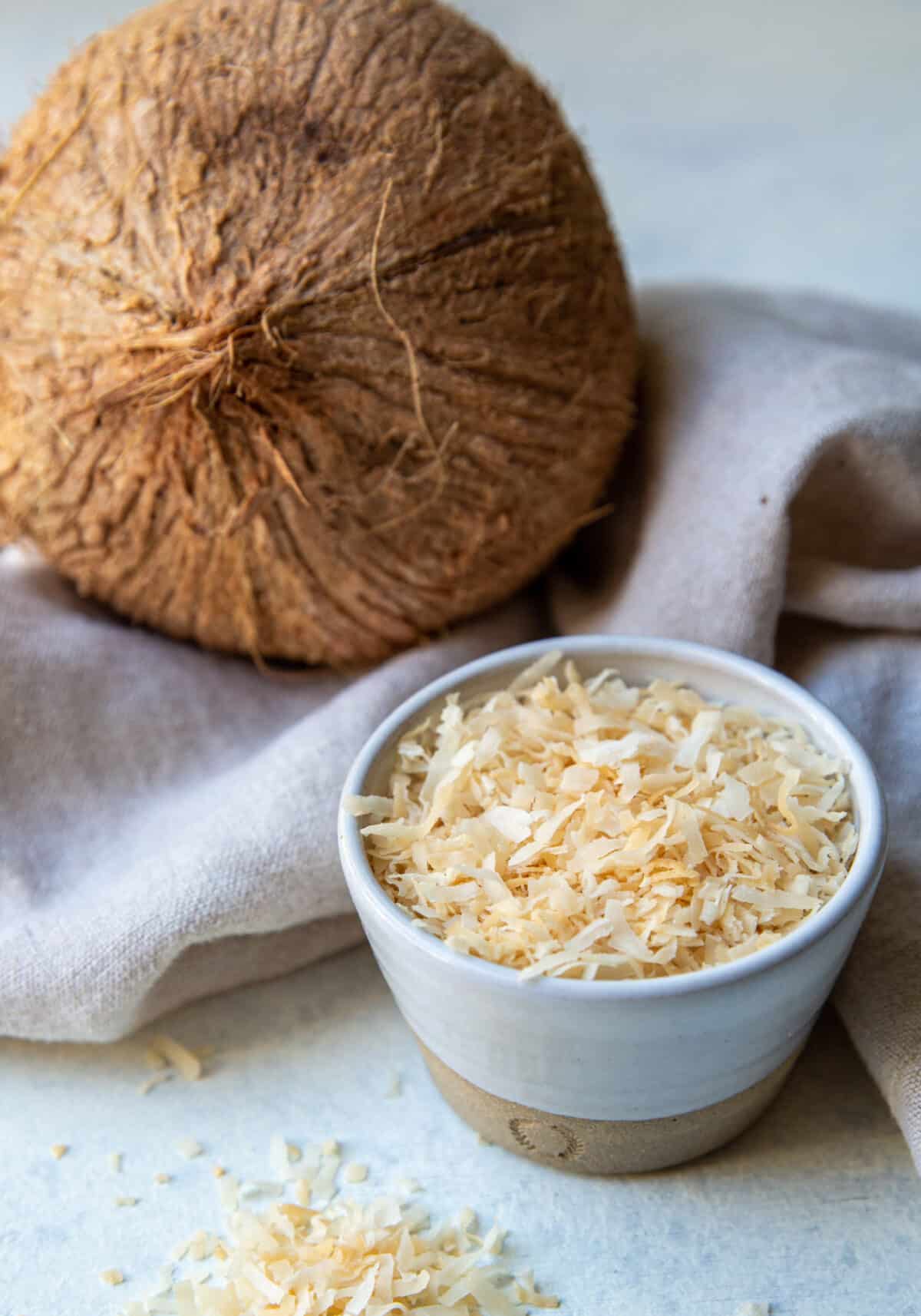 A bowl of toasted coconut.