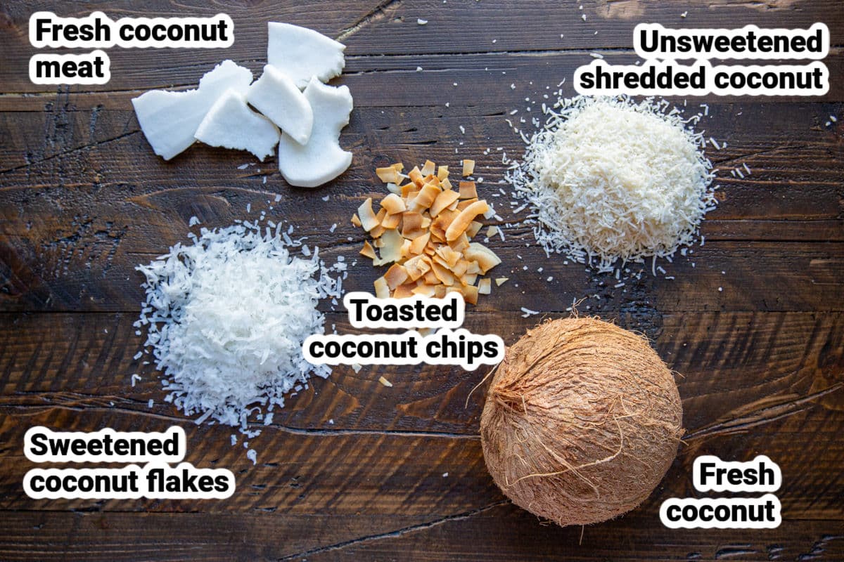 Piles of shredded coconut, coconut chips, and a whole coconut.