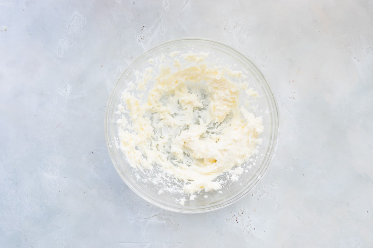 Butter and sugar creamed in a mixing bowl.