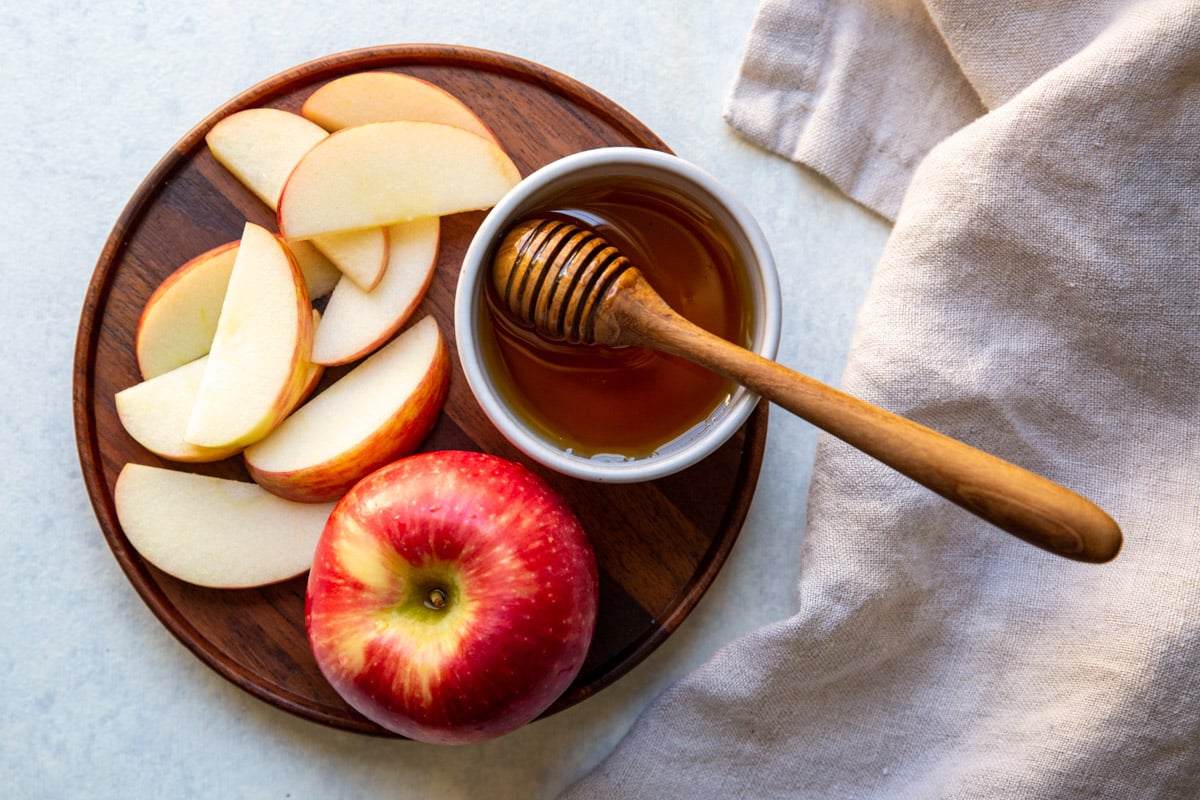 A plate of apples and honey for Rosh Hoshanah.