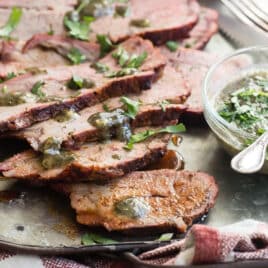 Slices of smoked tri tip on a serving platter.