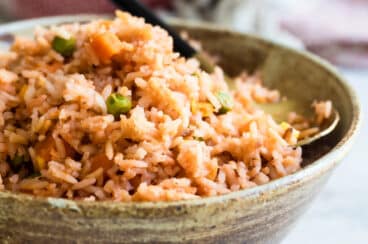 Spanish rice in a brown bowl.