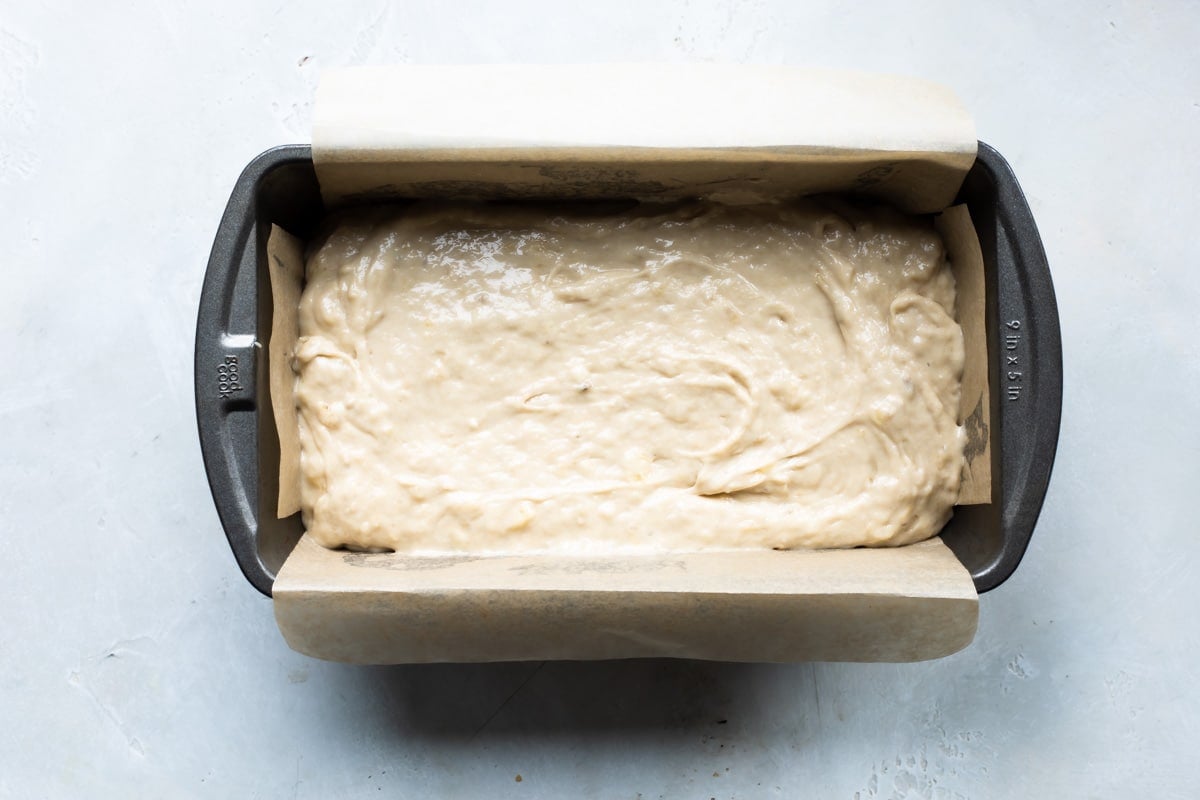 Banana bread batter in a loaf pan.