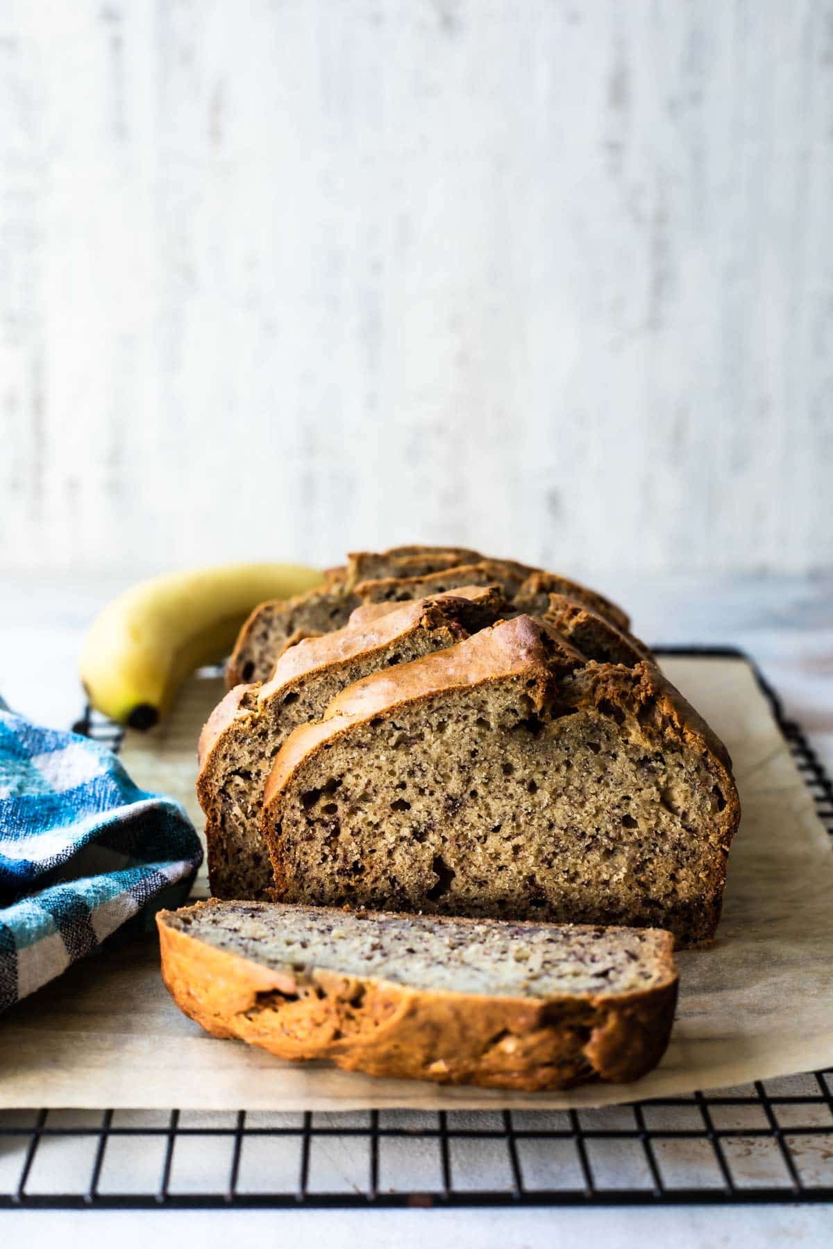 Slices of banana bread on a board.