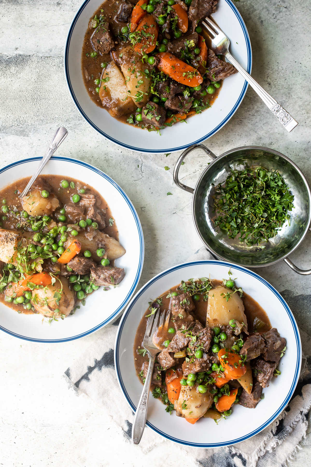 Bowls of beef stew on a table.
