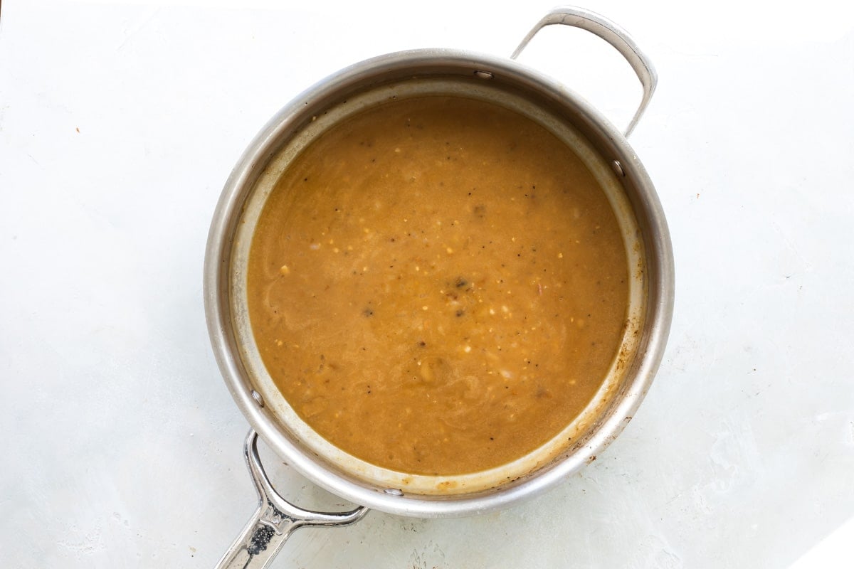Deglazing a pan with Marsala wine.