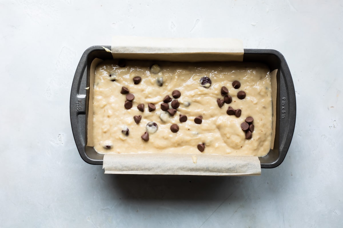 Banana bread batter in a loaf pan.