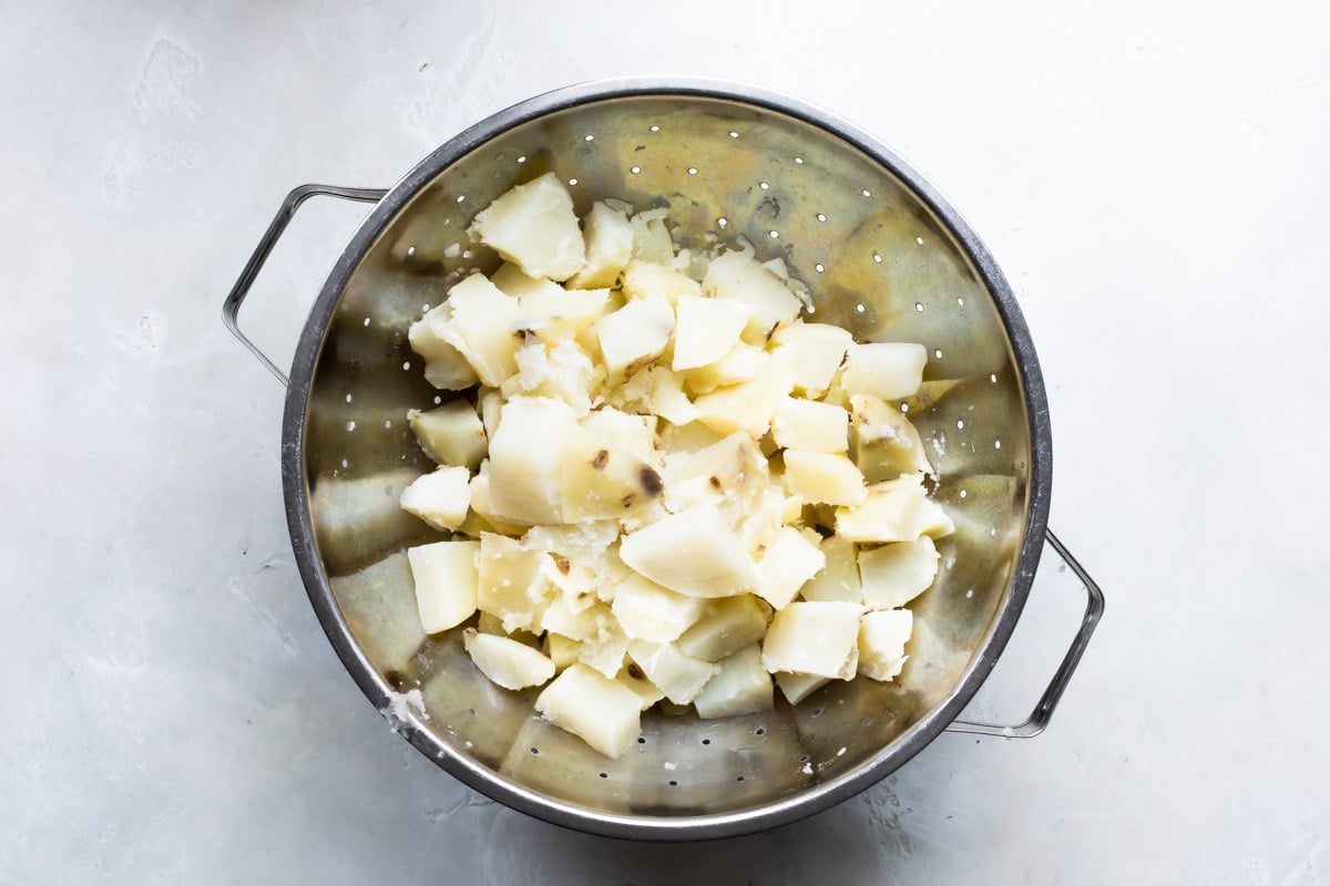 Potatoes in a strainer.