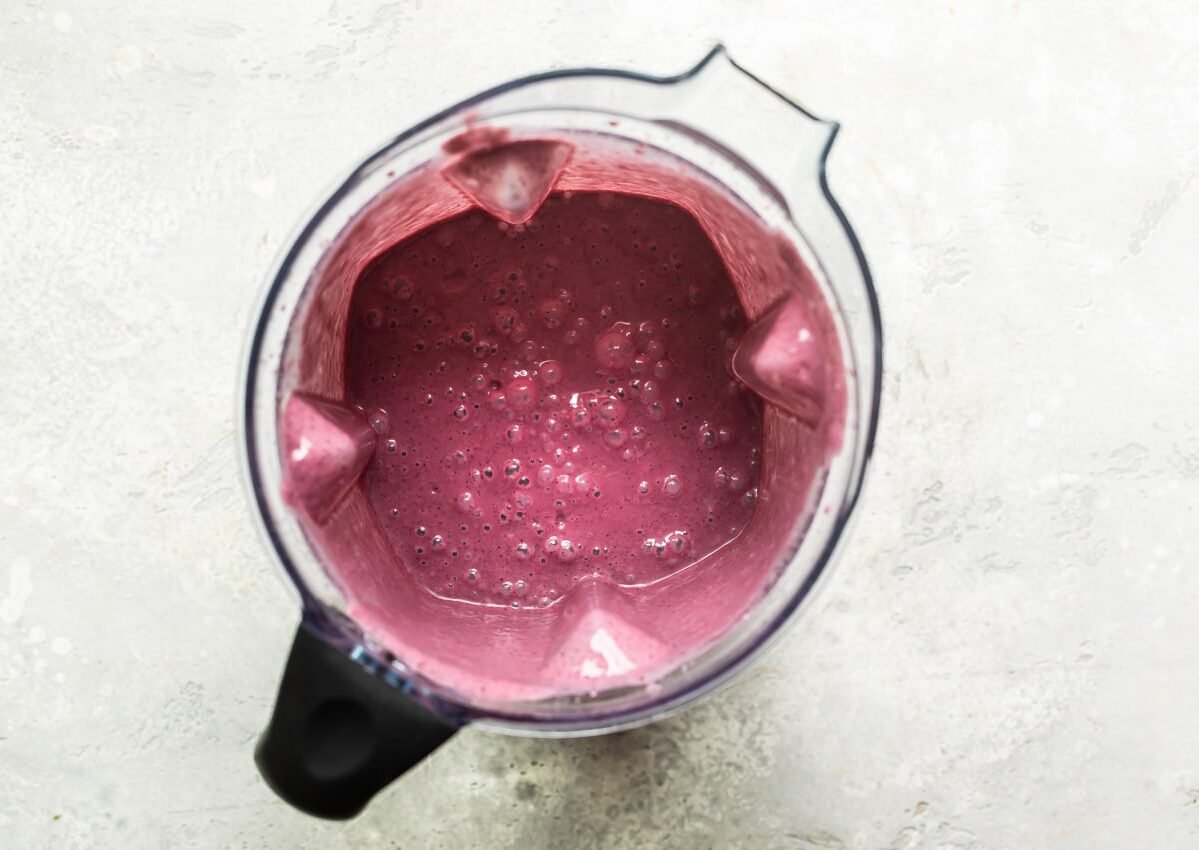 Blended acai in a blender.