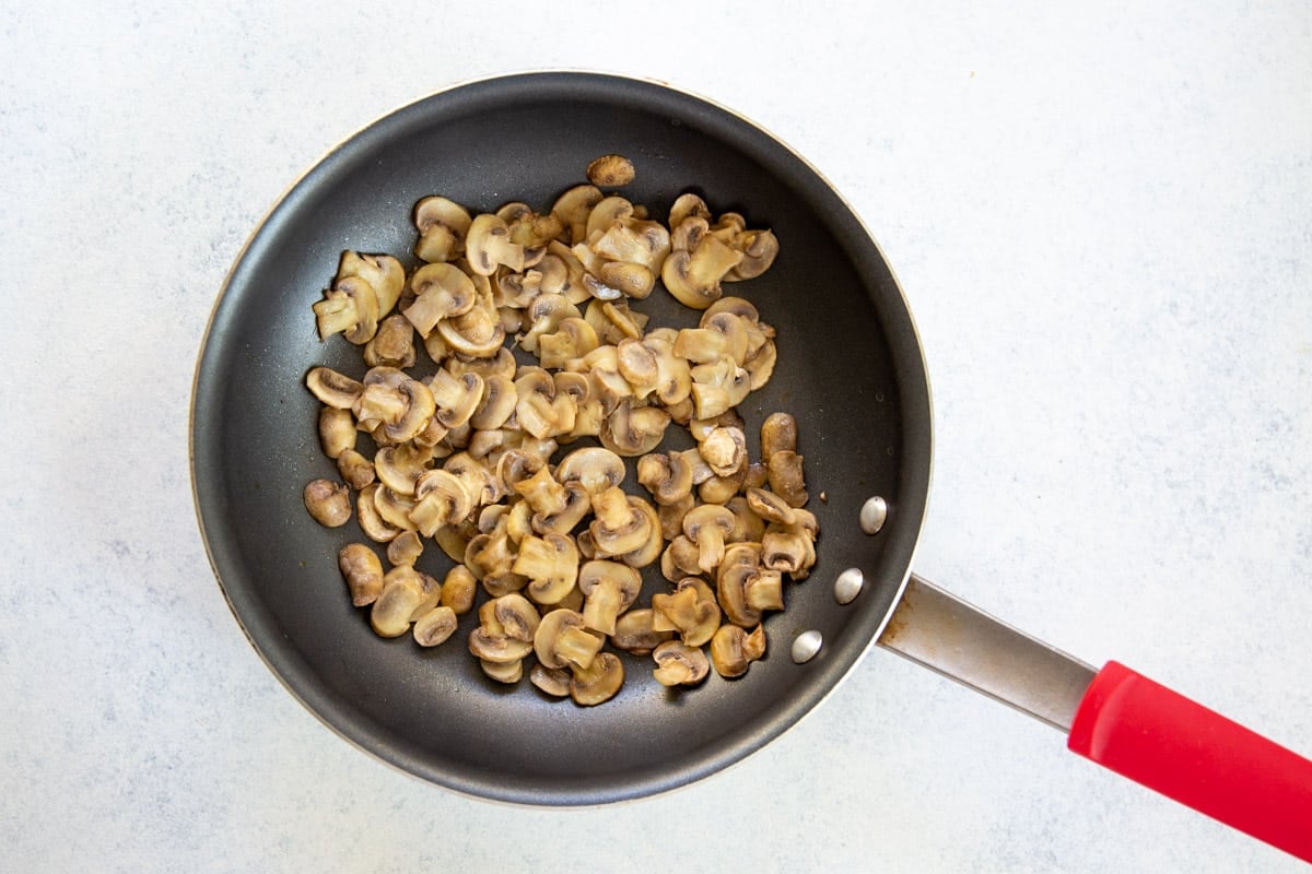 Cooked mushrooms in a skillet.