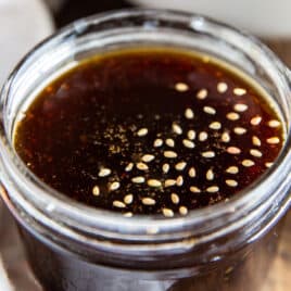 A glass jar of homemade teriyaki sauce.