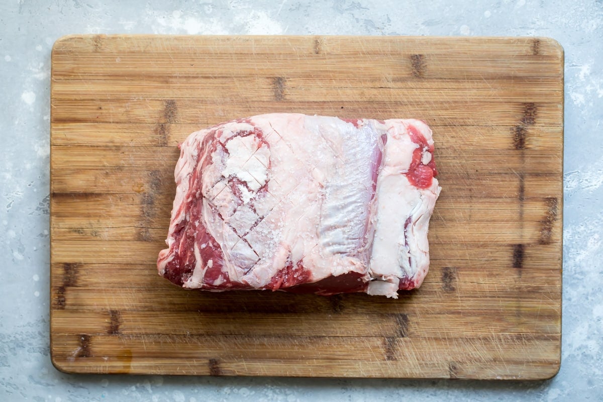 Prime rib on a cutting board.