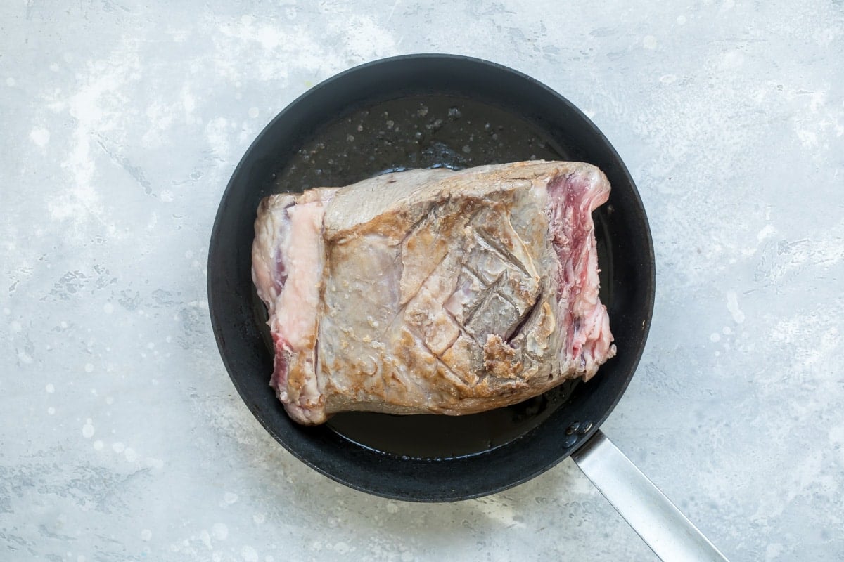 Prime rib in a skillet.