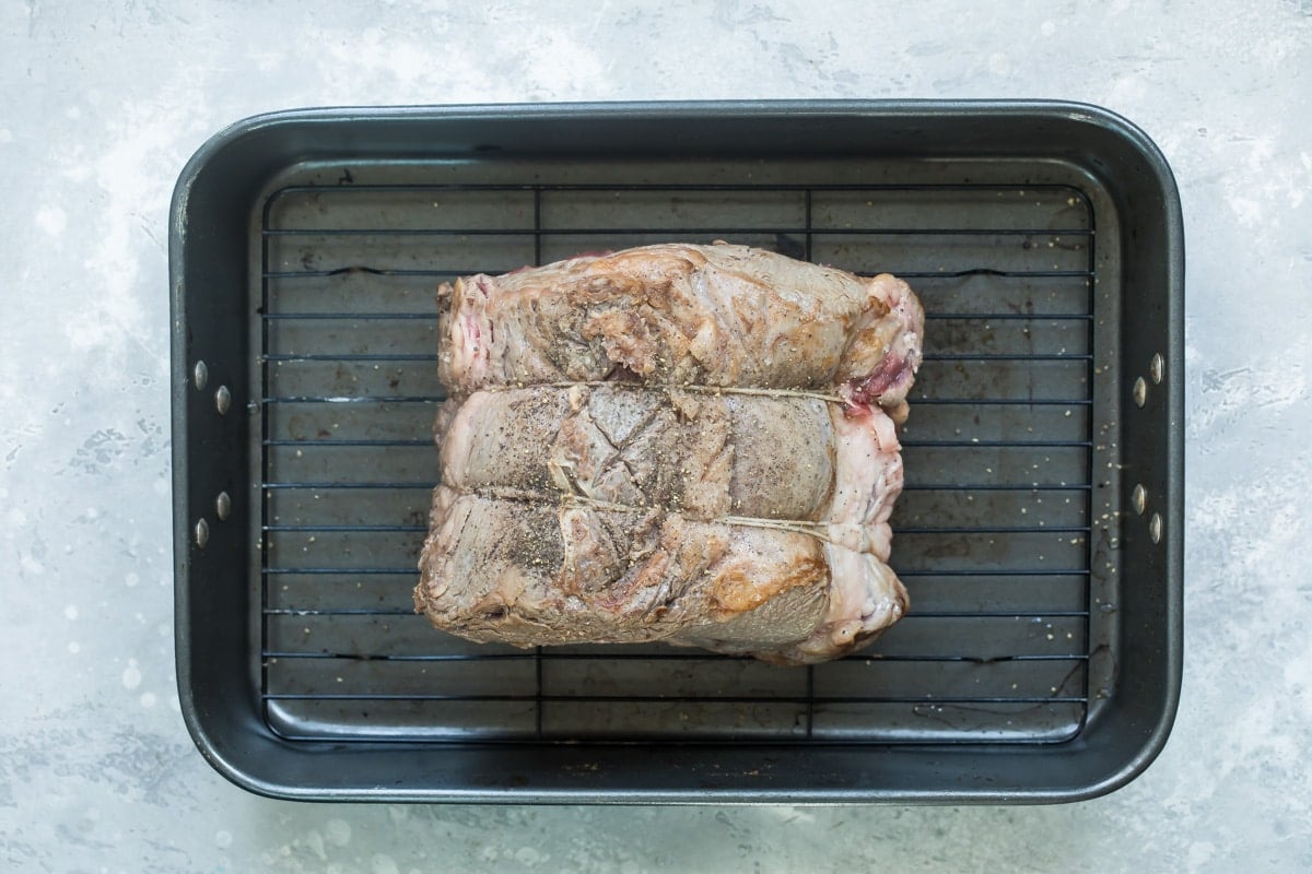 Prime rib in a baking pan.
