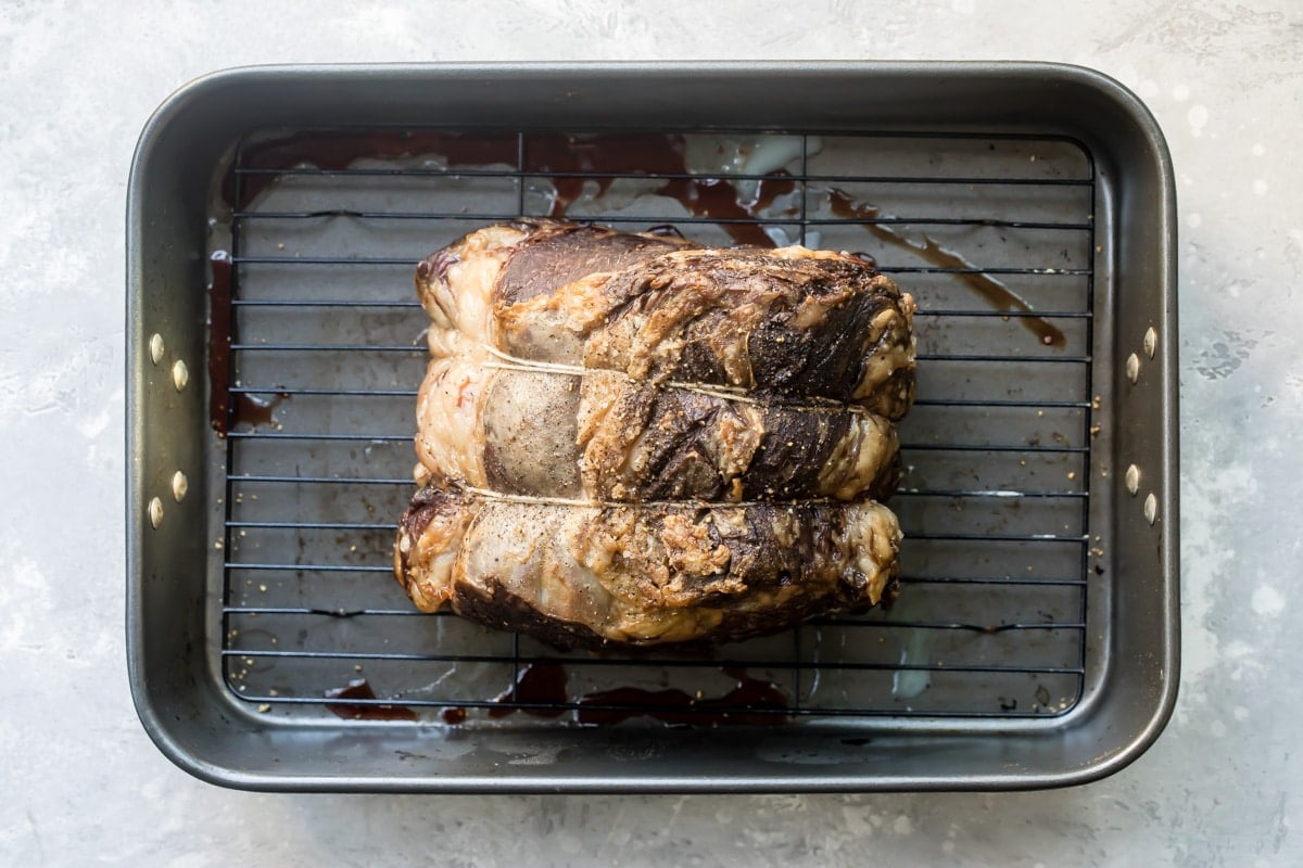Prime rib in a baking pan.