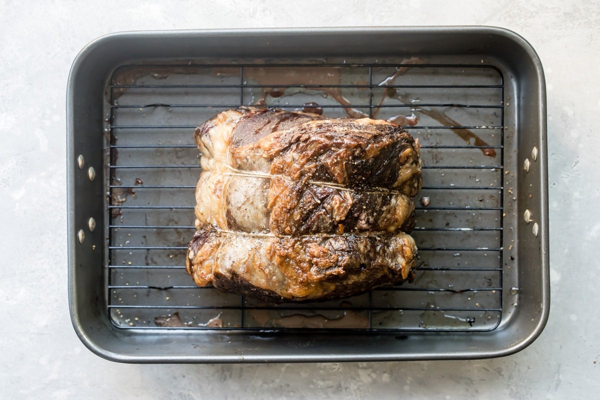 Prime rib in a baking pan.