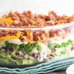 Seven layer salad in a glass dish.