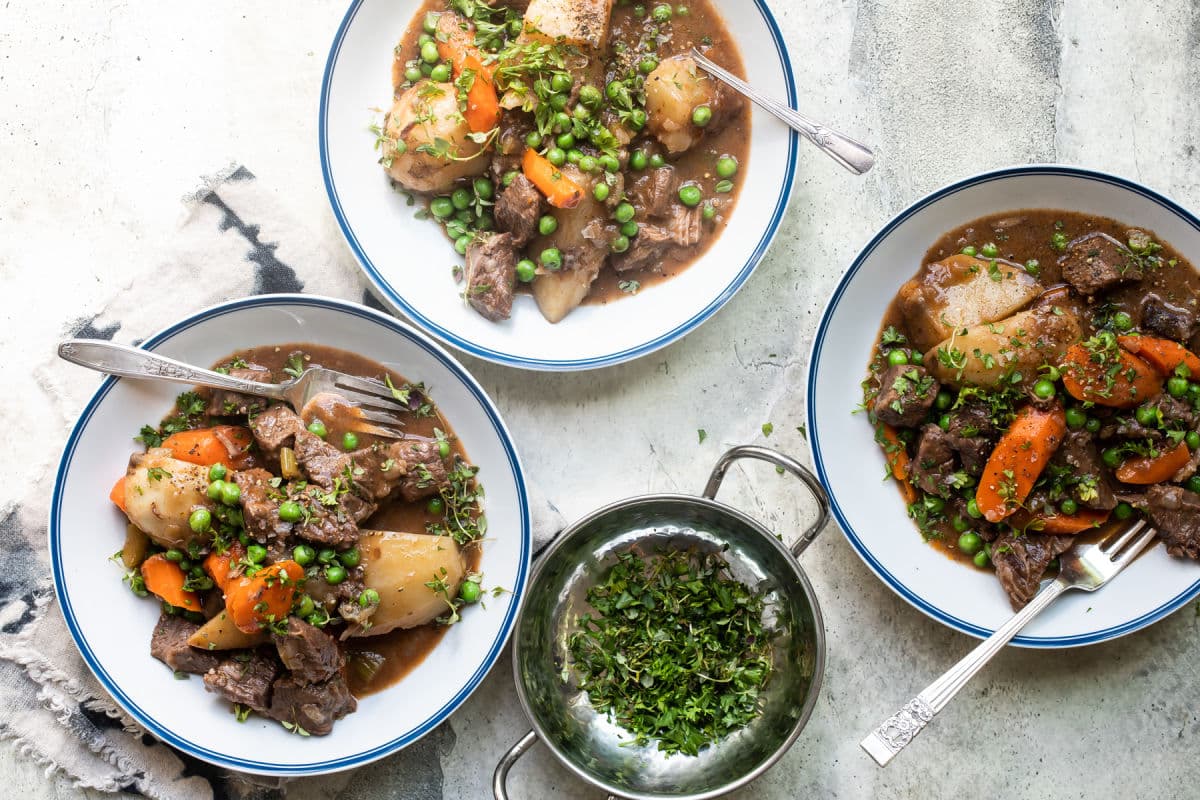 Bowls of venison stew on a table.