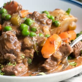 Venison stew in a white bowl.
