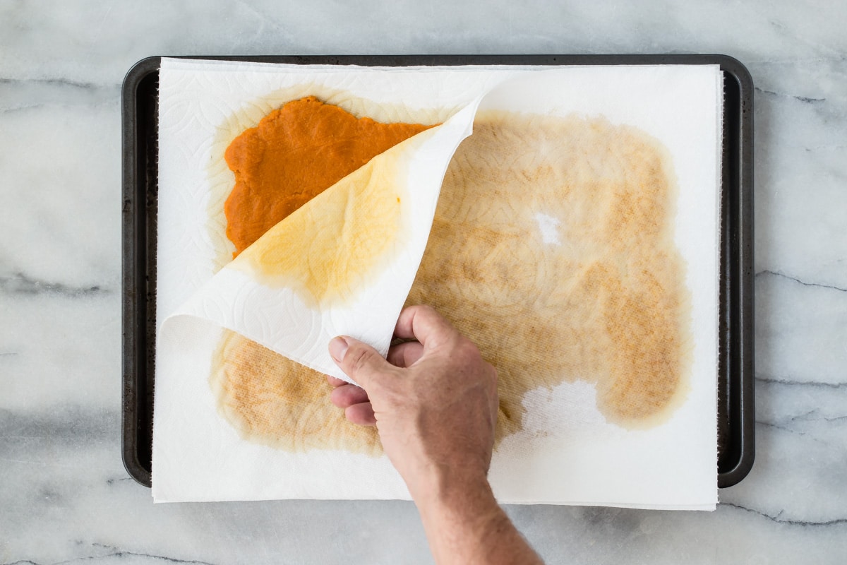Draining pumpkin pie filling on paper towels.