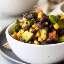 Black bean salad in a white bowl.