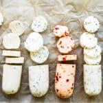 Compound butter shown six different ways on a piece of brown parchment paper.