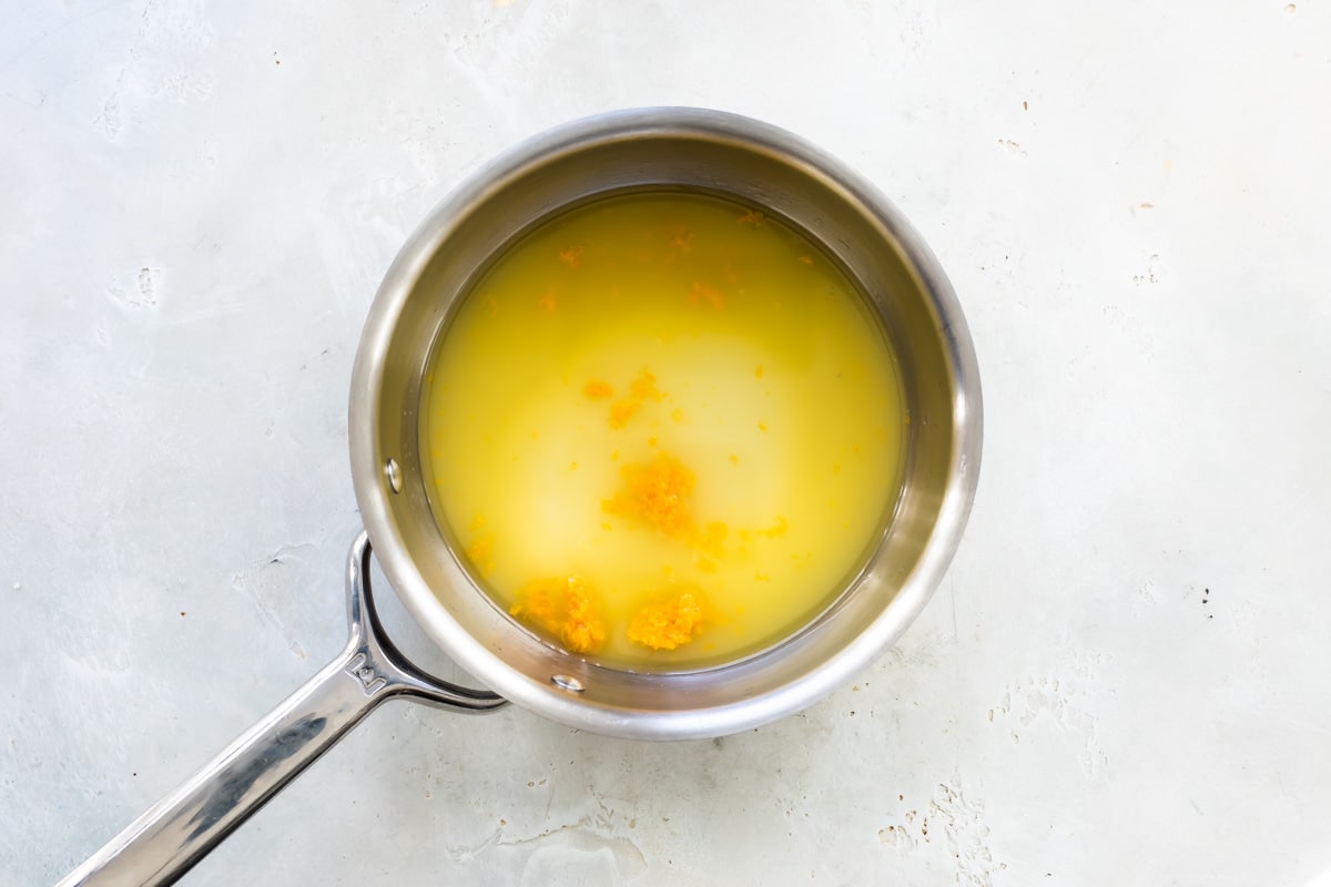 Orange juice, water, and sugar in a small pot.