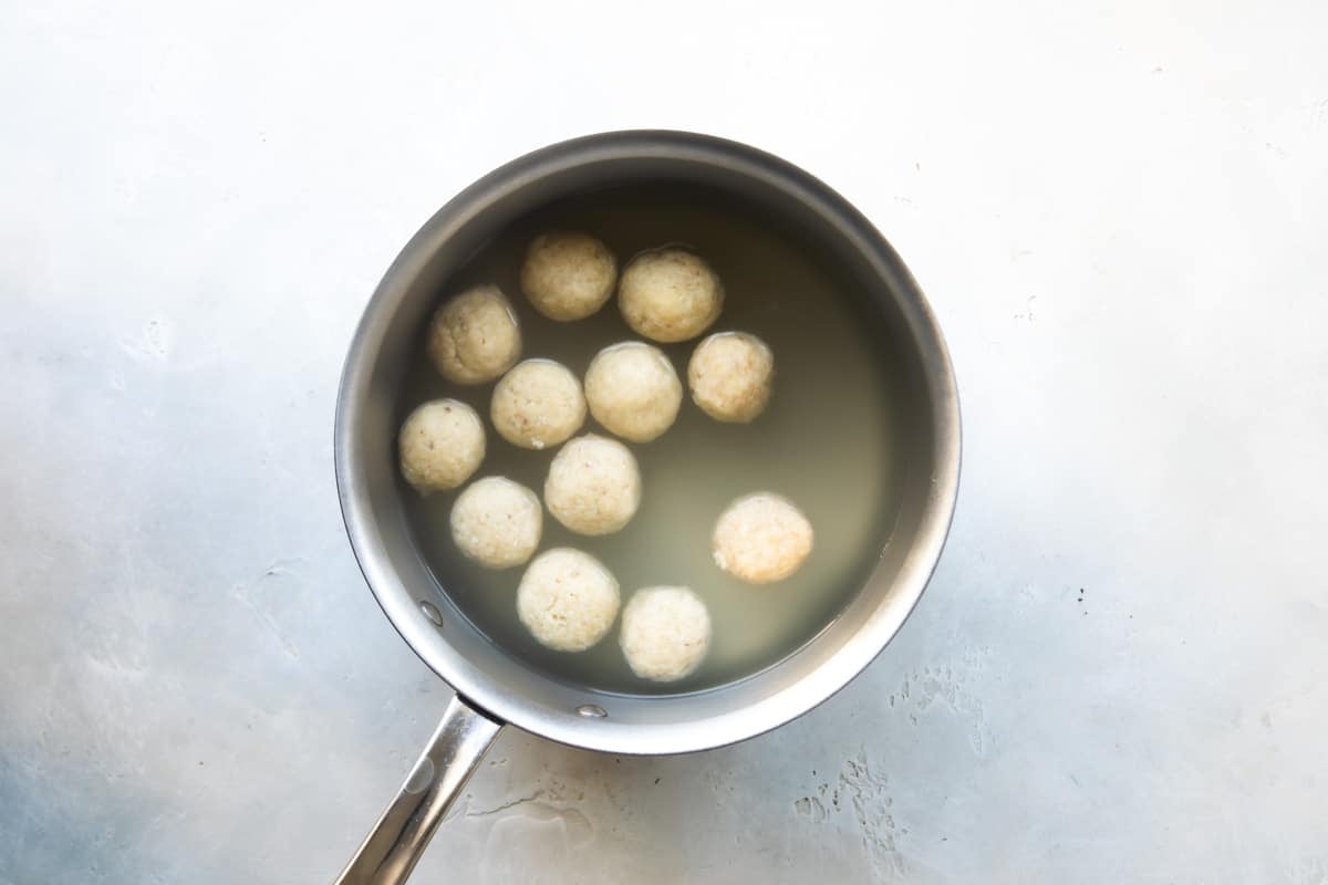 Boiling matzo balls for matzo ball soup.