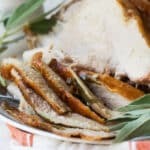 Sliced roasted turkey breast on a platter.