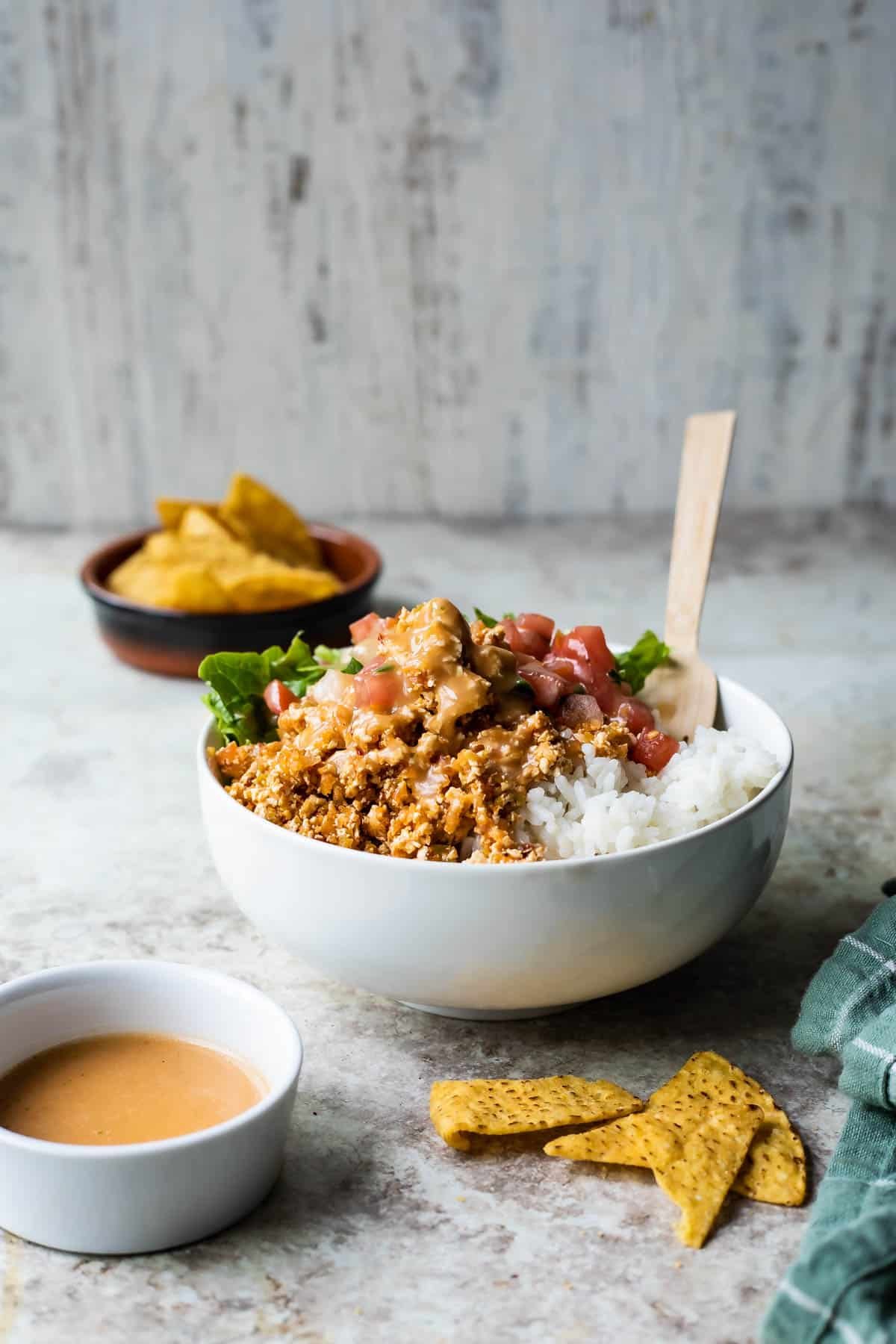 Chipotle sofritas in a white bowl with rice.