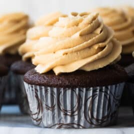Chocolate Cupcakes with Peanut Butter Frosting on a marble platter.