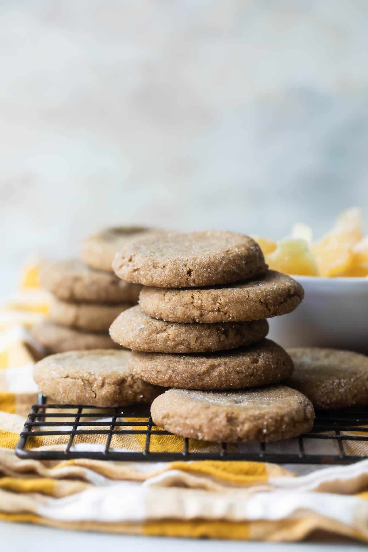 A stack of double ginger cookies on a cooling rack.