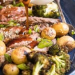 A platter of Hibachi Steak with Grilled Wasabi potatoes and teriyaki sauce being drizzled over it.