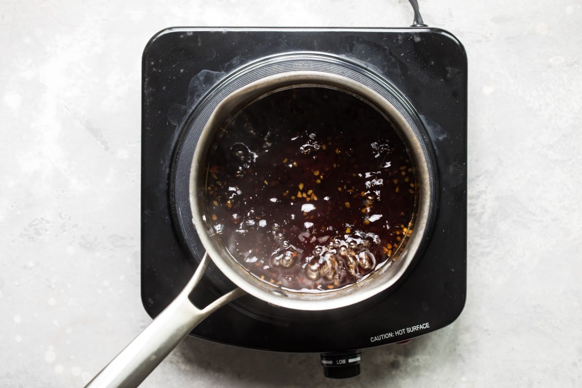 Teriyaki sauce cooking in a saucepan.