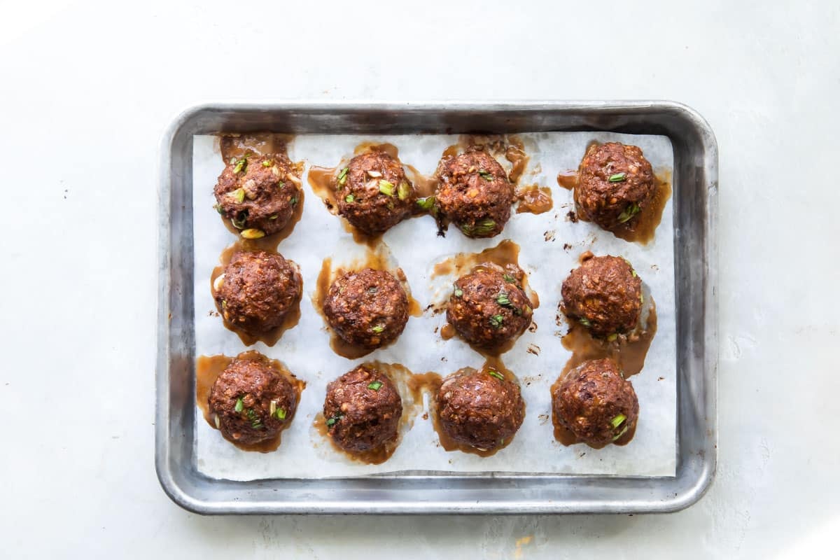 Korean barbecue meatballs on a baking sheet.
