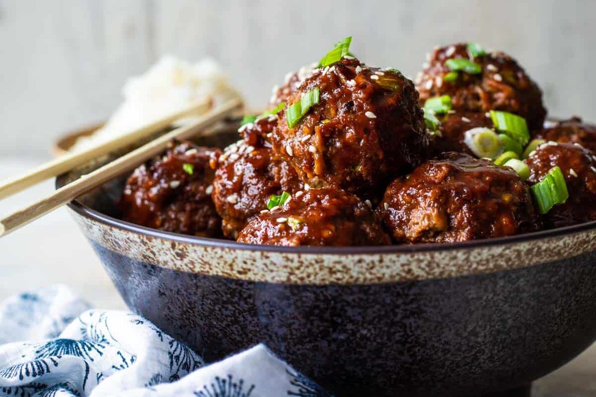 Korean barbecue meatballs in a gray bowl.