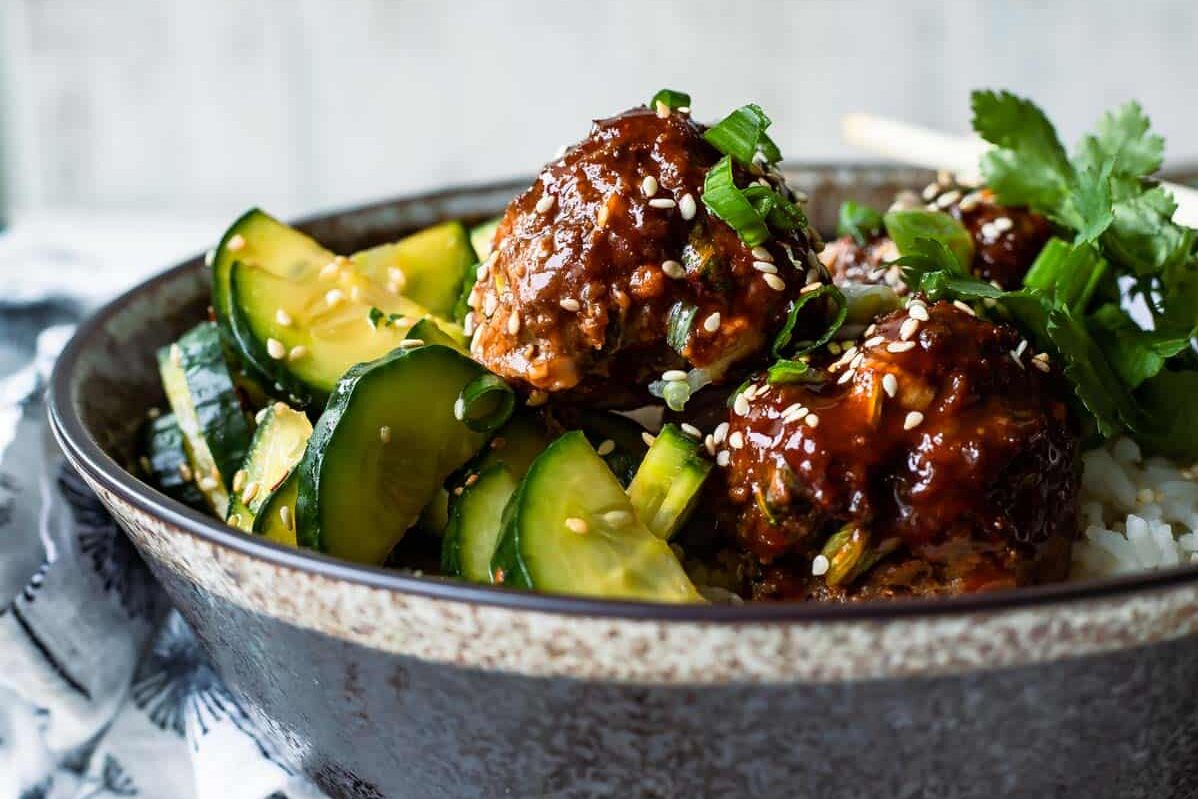 Korean barbecue meatballs in a gray bowl.
