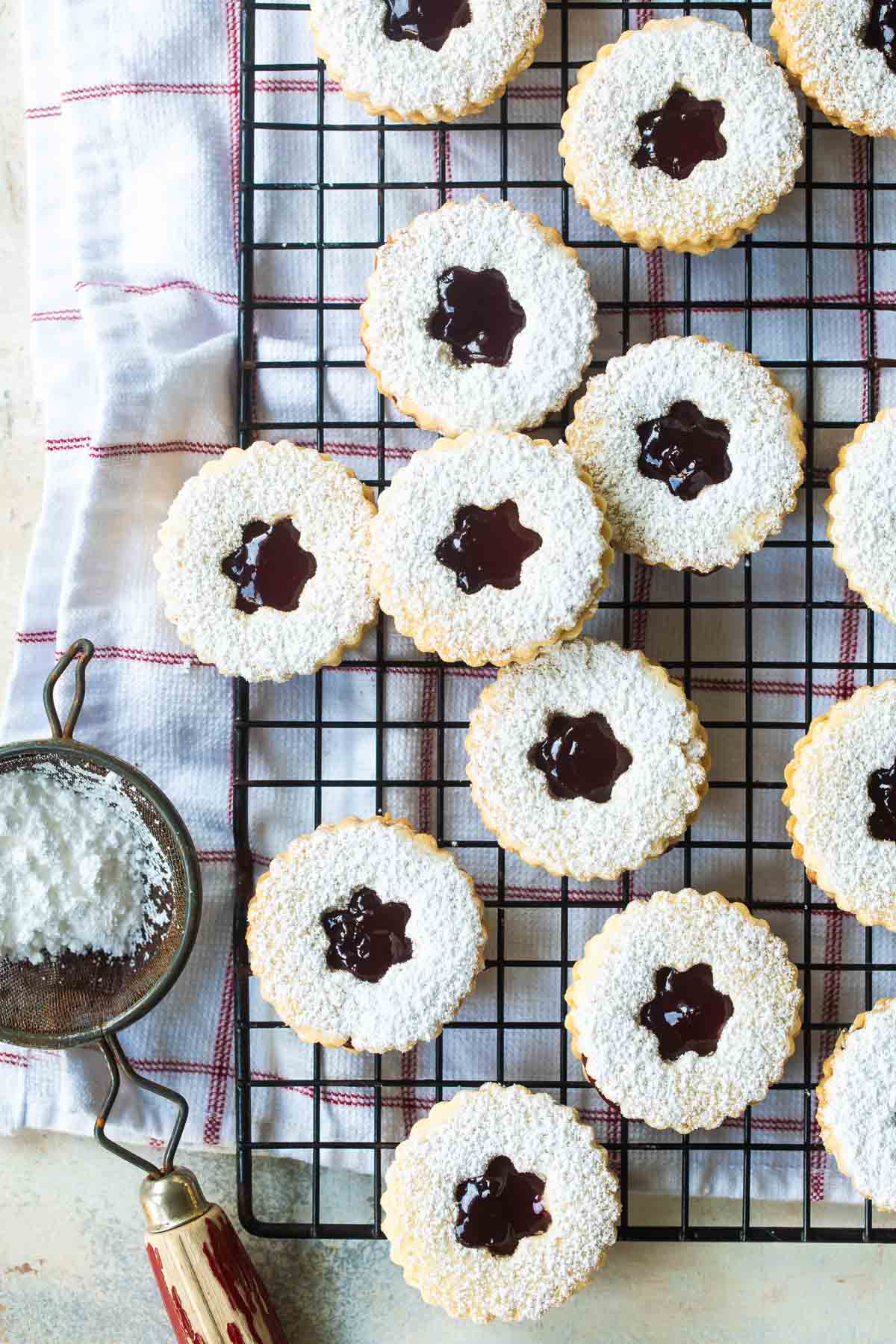 Linzer cookies on a cooling rack.