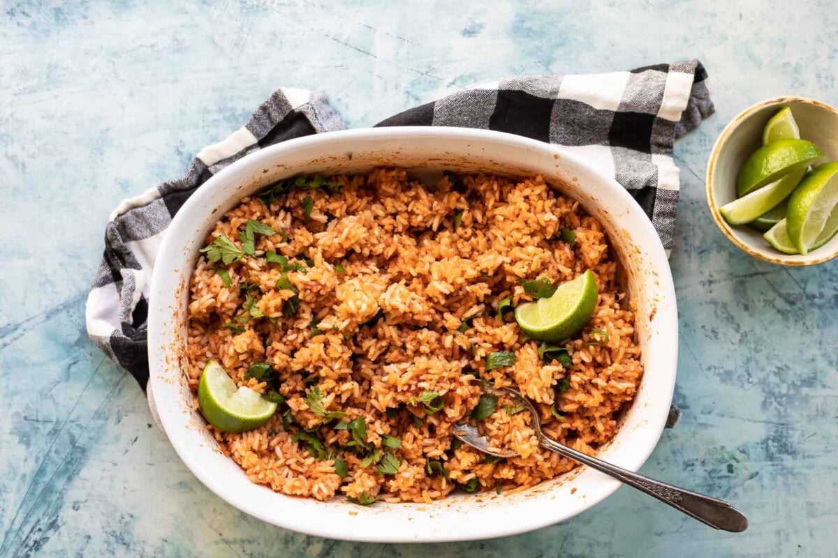 Mexican rice in a white serving dish.