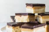 Squares of millionaire's shortbread on a plate.