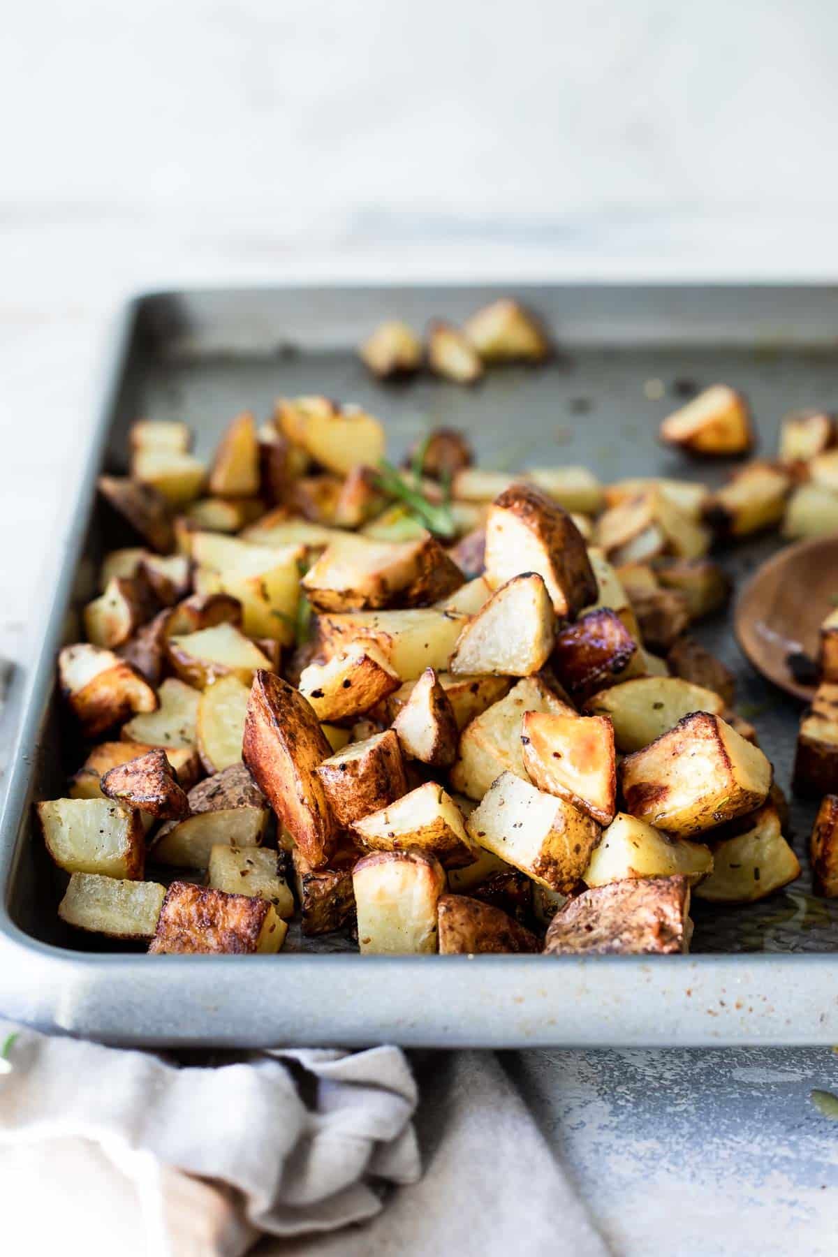 A baking sheet with oven roasted potatoes.