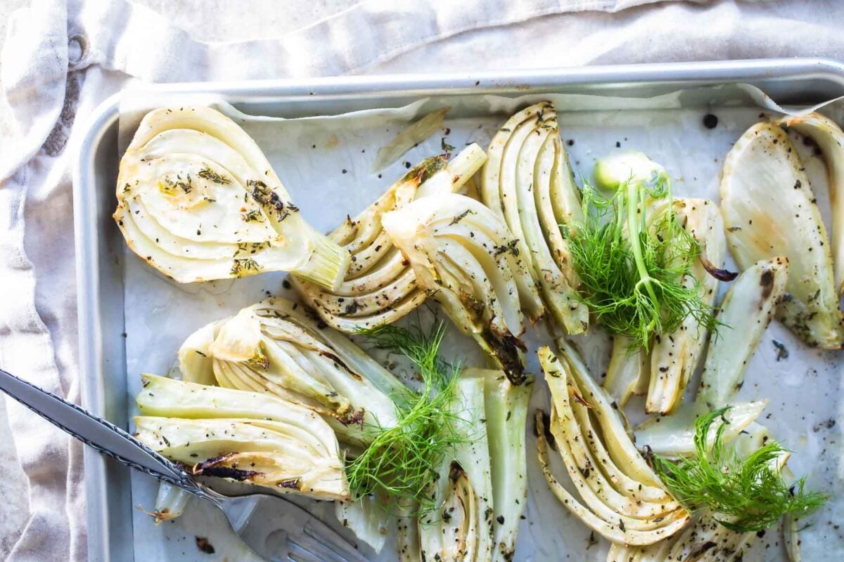 Roasted fennel on a baking sheet.
