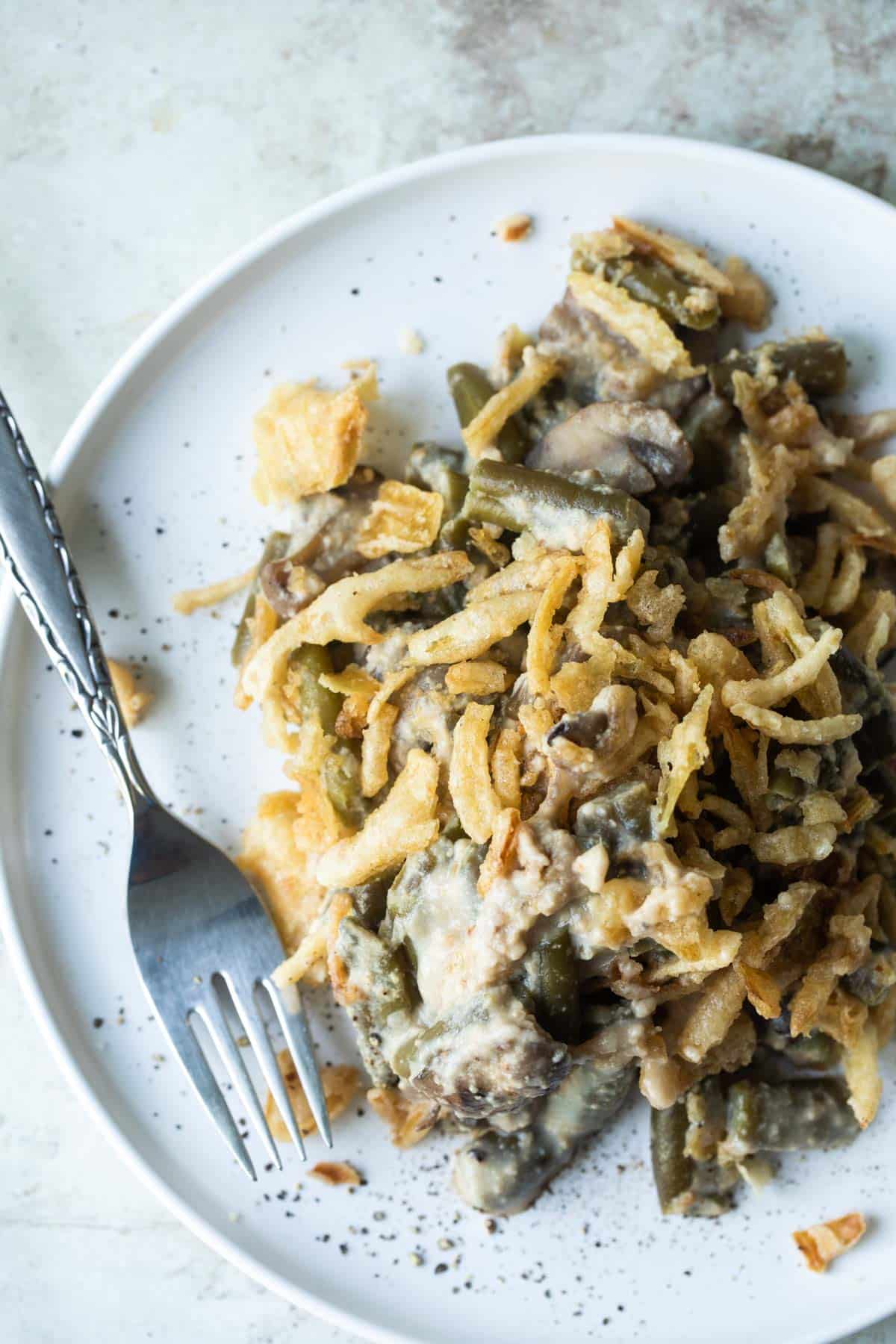 A plate with vegan green bean casserole.