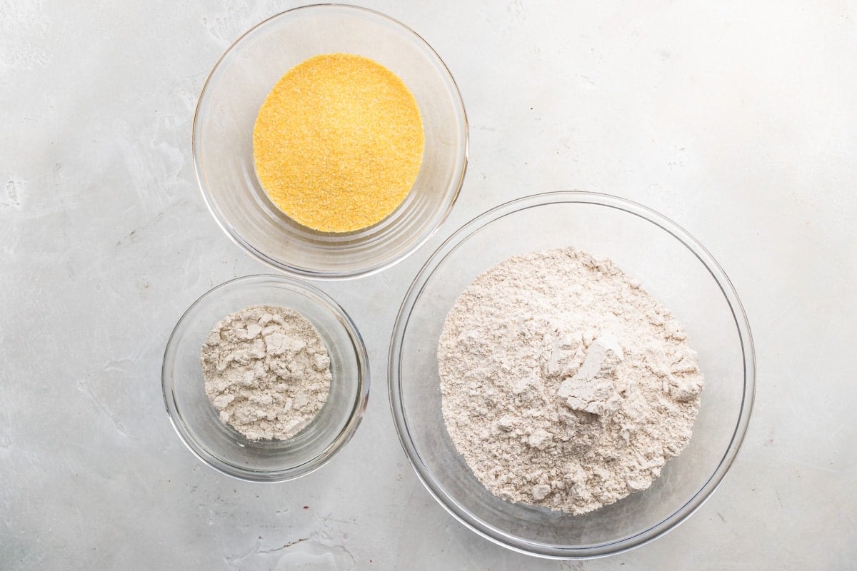 Bowls of dry ingredients to make dry pancake mix.